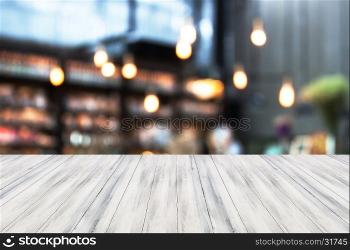 White luxury top wooden with blurred cafe background. product display template