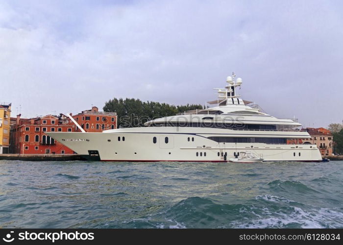 White luxury yacht near pier in Venice, Italy&#xA;