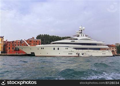 White luxury yacht near pier in Venice, Italy&#xA;