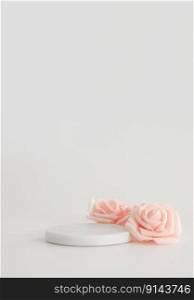 White marble podium on the white background with pink flowers. Podium for product, cosmetic presentation. Creative mock up. Pedestal or platform for beauty products. White marble podium on the white background with pink flowers. Podium for product, cosmetic presentation. Creative mock up. Pedestal or platform for beauty products.
