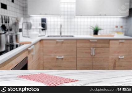 White marble texture table top on blurred kitchen background