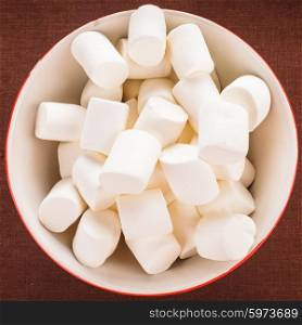 White marshmallows close up in a bowl. marshmallows in a bowl