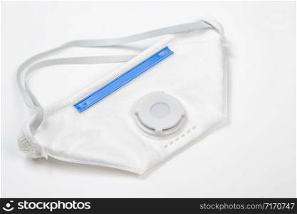 white medical protective mask against viruses and infections on a white background