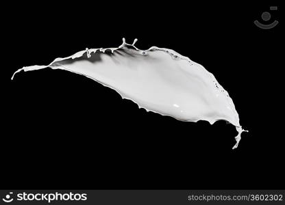 White milk splash isolated on black background