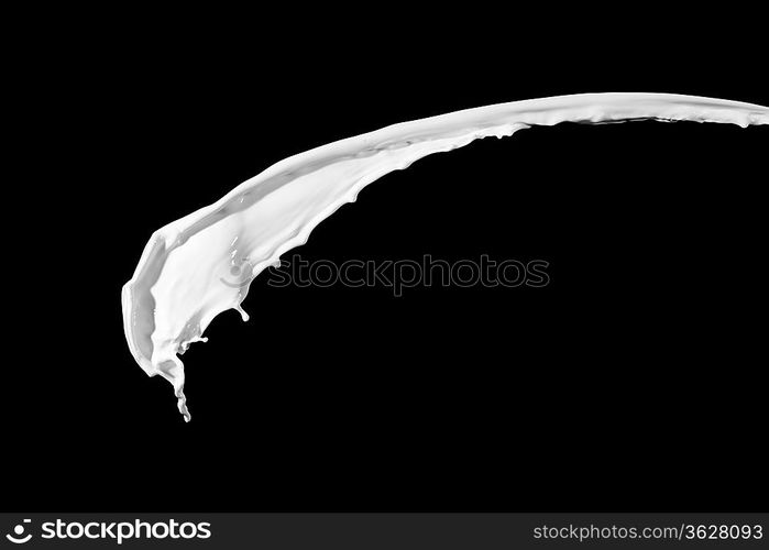 White milk splash isolated on black background