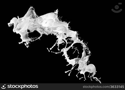 White milk splash isolated on black background