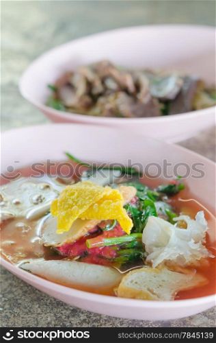 white noodles in pink soup . white noodles in pink soup with seafood ( Yen Ta Four )