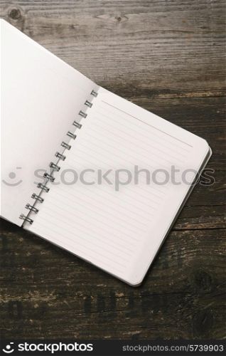 white Notepad on a dark wooden background