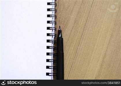 White notepad on the wooden desk