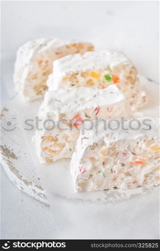 White nougat slices on cutting board