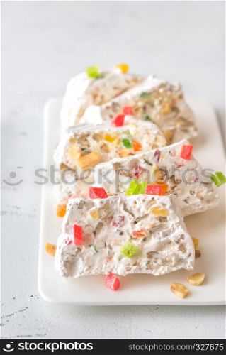 White nougat slices on white plate