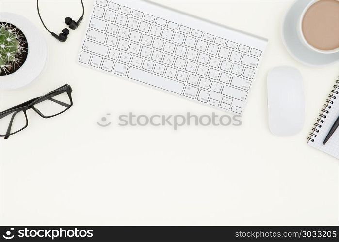 White office desk table with laptop, cup of coffee and supplies.. workspace with keyboard. White office desk table with laptop, cup of coffee and supplies. Top view with copy space.