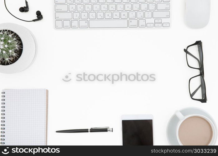 White office desk table with laptop, cup of coffee and supplies.. workspace with keyboard. White office desk table with laptop, cup of coffee and supplies. Top view with copy space.