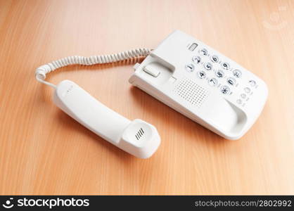 White office phone on the flat surface