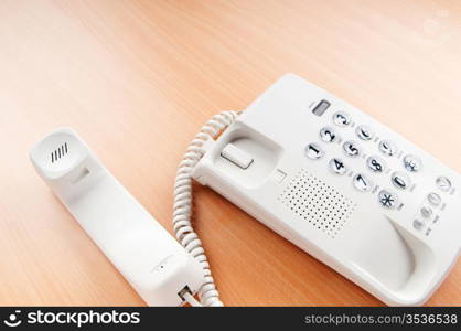 White office phone on the flat surface