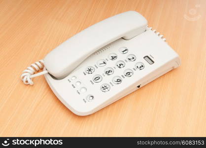 White office phone on the flat surface