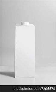 White packaging tetra-pack standing on light gray background, front view. Empty template box milk or juice. Package branding mock-up