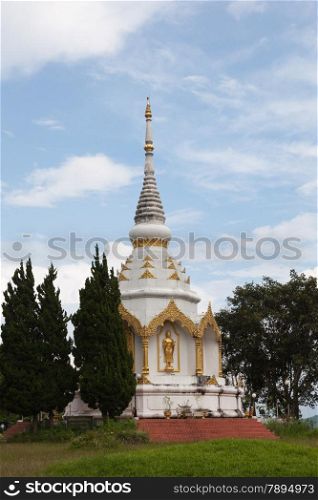 White pagoda. Close to the grass. The sky was clear in the morning.