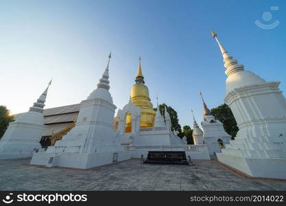 White pagoda or stupa of Wat Suan Dok buddhist Temple, Chiang Mai City, Thailand. Thai architecture. Tourist attraction landmark.