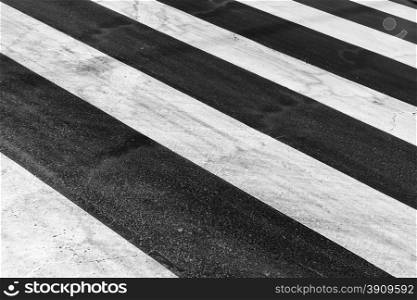 White painted pedestrian crossing on the road.
