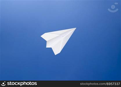 White paper airplane on a blue sky background. The symbol of freedom and privacy on the Internet.. White paper airplane on a blue sky background. The symbol of freedom and privacy on the Internet. White paper airplane on a blue sky background. The symbol of freedom and privacy on the Internet