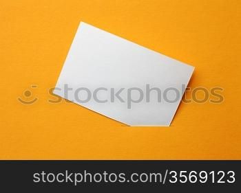 white paper card on orange background
