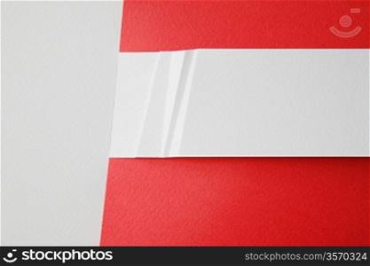 white paper card on red background