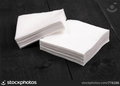 white paper napkins on wooden background
