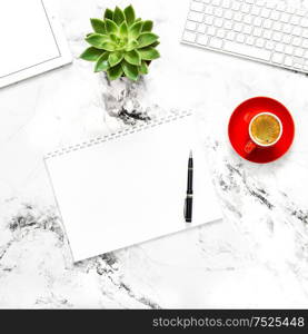 White paper, notebook, tablet pc on working desk. Flat lay