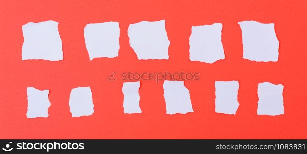 White paper torn into words on a red background