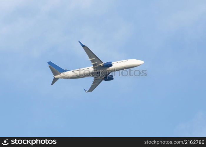 White passenger plane taking off