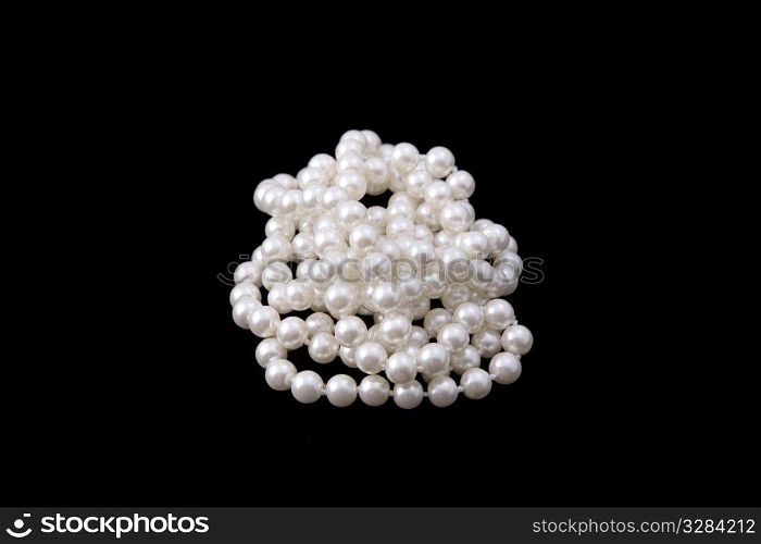 white pearl beads on black background