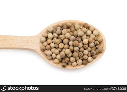 white peppercorns in wooden spoon