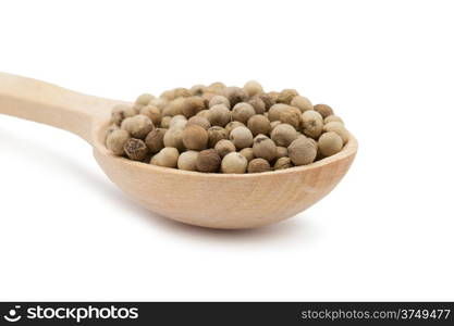 white peppercorns in wooden spoon