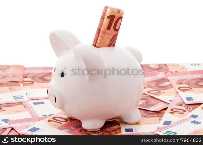 White piggy bank with euro bills over a white background