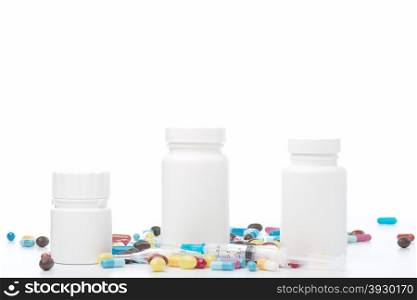 White pill bottle and colorful pills on white background. White plastic pill bottle and colorful pills on white background