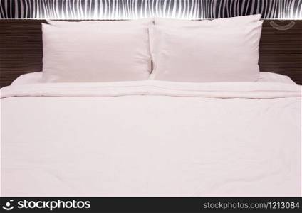 white pillow on the bed