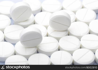 White pills on a white background. White round pills on a white background