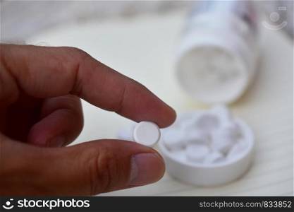 White pills placed on the table
