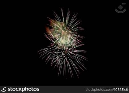 White Pink Sparkling Fireworks Background on Night Scene. Abstract color fireworks background and smoke on sky