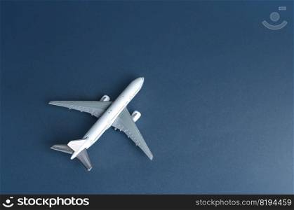 White plane. Cargo or passenger airliner. Business and tourism. Airline operators, air carriers. World communication and commercial flights. Travel. Logistics and transport infrastructure