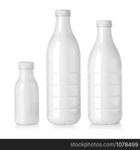 White plastc bottles with milk isolated on white background