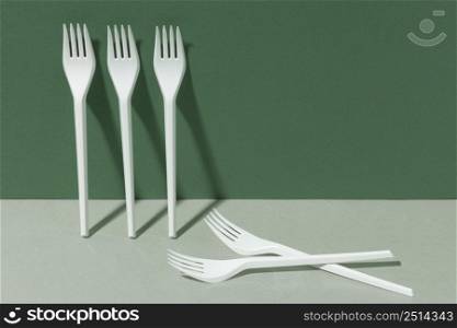 white plastic forks copy space