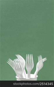 white plastic forks cup copy space