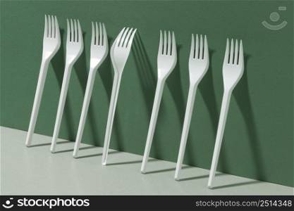 white plastic forks side view