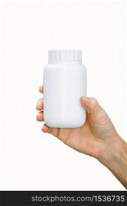 white plastic medicine bottle in Doctor holding hand and isolated on white background