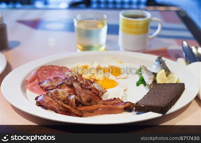 white plate with hotel full English breakfast