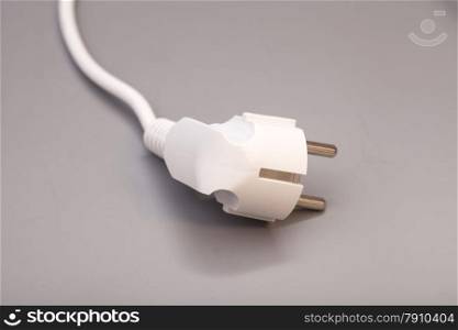 White plug isolated on gray background