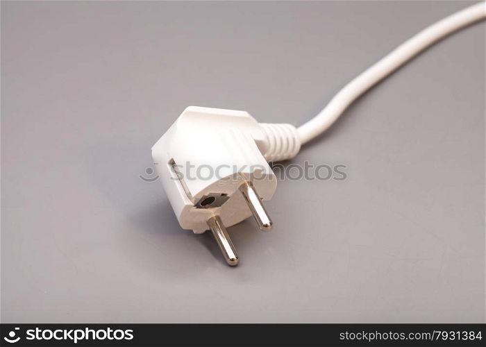White plug isolated on gray background