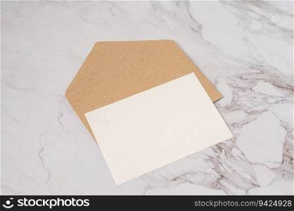 white postcard and brown envelope